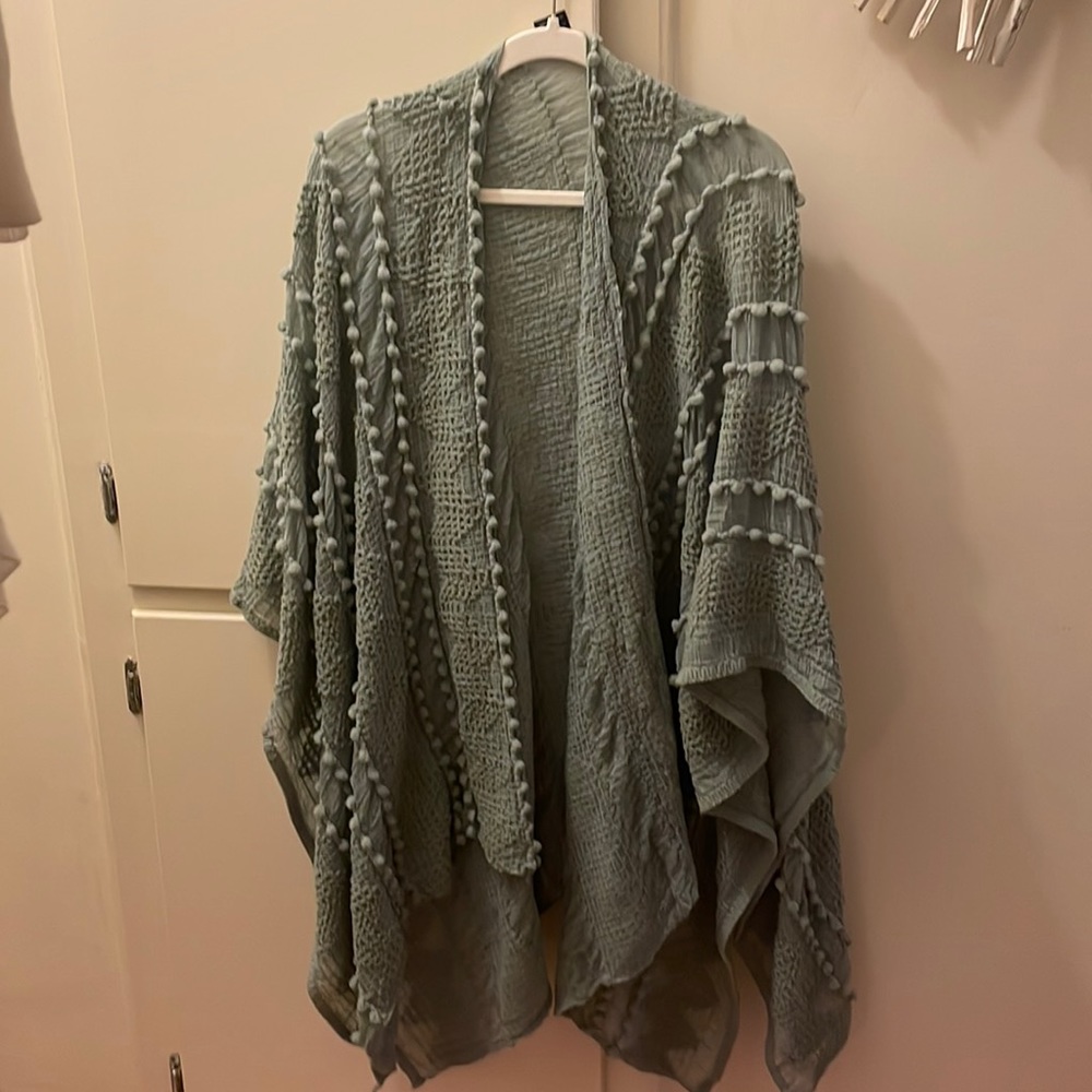 A brand new Saachi light moss green from poncho from Nordstrom
